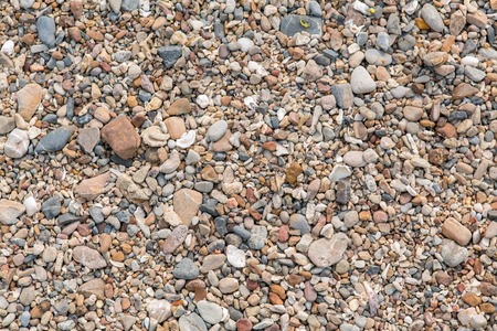 Different size and colour sea stones background and textureの写真素材