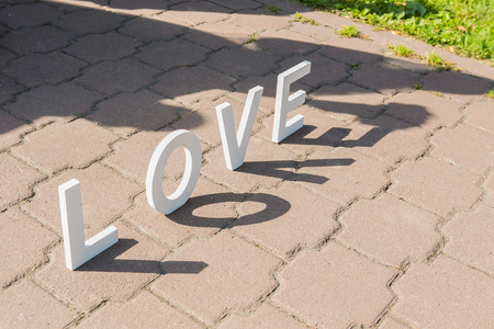 Shadows of love letters and just married coupleの写真素材