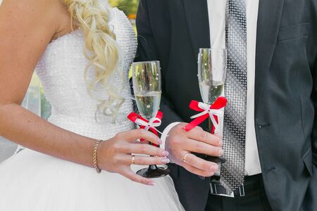 Wedding couple. The bride and groom with champagne glasses.の写真素材