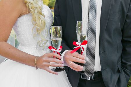 Wedding couple. The bride and groom with champagne glasses.の写真素材