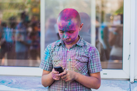 Young boy on the festival of colors Holi in Russia, Novokuznetskのeditorial素材