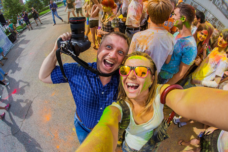 NOVOKUZNETSK, KEMEROVO REGION, RUSSIA-JULY 27, 2014 :: Friends making selfie on the festival of colors Holi in Russia, Novokuznetsk 27 July, 2014.のeditorial素材