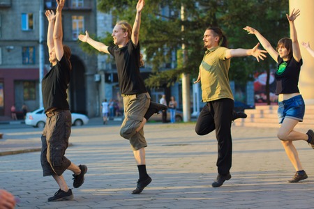 NOVOKUZNETSK, KEMEROVO REGION, RUSSIA-JUNE 24, 2012 ::  Young people are dancing irish dance on the street in city of Novokuznetsk  June 24 2012.のeditorial素材