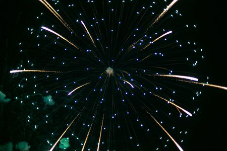 Beautiful colorful holiday fireworks on the black sky background,  long exposure