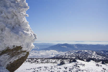 Beautiful winter landscape with snow, mountains and treesの写真素材