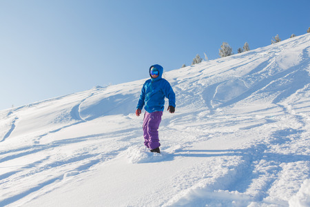 Sheregesh, Kemerovo Region, Russia - January 20, 2016 :: Snowboarder riding fresh snow powder in mountains of Sheregesh.のeditorial素材