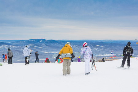 Sheregesh, Mountain Shoria, Kemerovo Region, Russia - February 08, 2016 :: Snowboarders and mountain ski riders on the top of the mountain.のeditorial素材