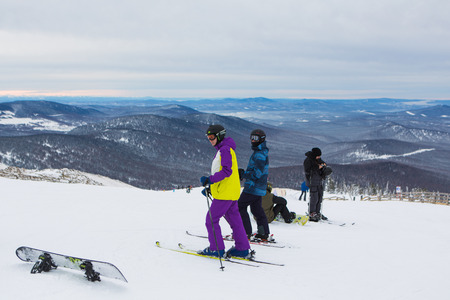 Sheregesh, Mountain Shoria, Kemerovo Region, Russia - February 08, 2016 :: Snowboarders and mountain ski riders on the top of the mountain.のeditorial素材