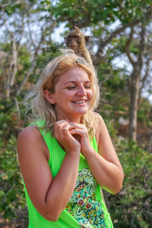 Monkey Island, Thailand - February 01, 2015 :: Caucasian tourists in Thailand on the Monkey Isaland with wild monkeys.のeditorial素材