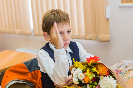 NOVOKUZNETSK, KEMEROVO REGION, RUSSIA - SEP, 1, 2016: First-grade students and teacher are in school classroom at first lesson. The day of knowledge in Russia.のeditorial素材