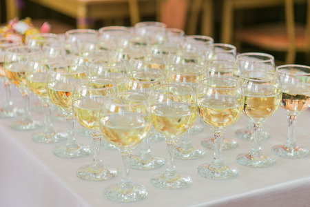 Glasses with champagne on the party tableの写真素材
