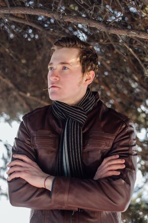 Man's handsome face with style hair in winter sunny day