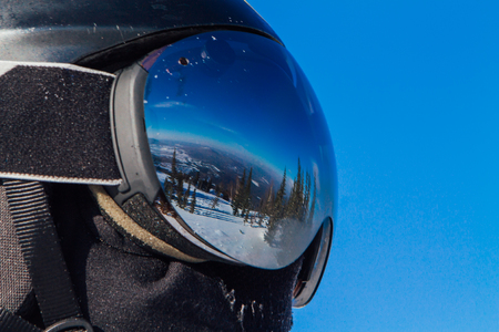 Beautiful reflection of wild nature in ski glassesの写真素材
