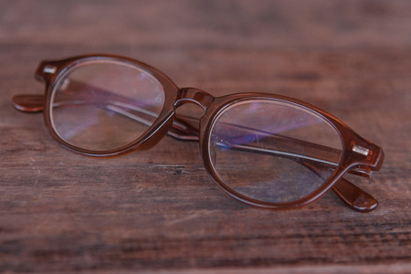 Old dirty glasses on a wooden tableの写真素材