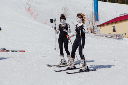 Sheregesh, Kemerovo region, Russia - April 22, 2017: Grelka Fest is a sports and entertainment activity for ski and snowboard riders in carnival costume. Young people in carnival costumes of zebras.のeditorial素材