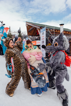 Sheregesh, Kemerovo region, Russia - April 22, 2017: Grelka Fest is a sports and entertainment activity for ski and snowboard riders in carnival costume. Young people in carnival costumes.のeditorial素材