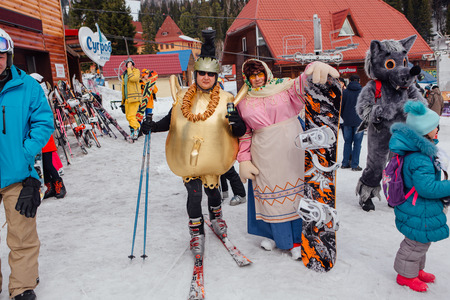 Sheregesh, Kemerovo region, Russia - April 22, 2017: Grelka Fest is a sports and entertainment activity for ski and snowboard riders in carnival costume. Young people in carnival costumes.のeditorial素材