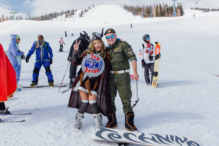 Sheregesh, Kemerovo region, Russia - April 22, 2017: Grelka Fest is a sports and entertainment activity for ski and snowboard riders in carnival costume. Young people in carnival costumes.のeditorial素材