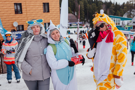 Sheregesh, Kemerovo region, Russia - April 22, 2017: Grelka Fest is a sports and entertainment activity for ski and snowboard riders in carnival costume. Young people in carnival costumes.のeditorial素材