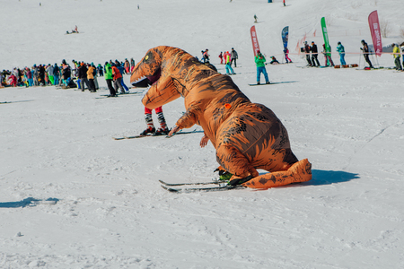 Sheregesh, Kemerovo region, Russia - April 22, 2017: Grelka Fest is a sports and entertainment activity for ski and snowboard riders in carnival costume. Young people in carnival costumes.のeditorial素材