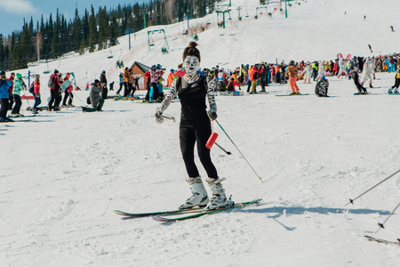 Sheregesh, Kemerovo region, Russia - April 22, 2017: Grelka Fest is a sports and entertainment activity for ski and snowboard riders in carnival costume. Young people in carnival costumes.のeditorial素材