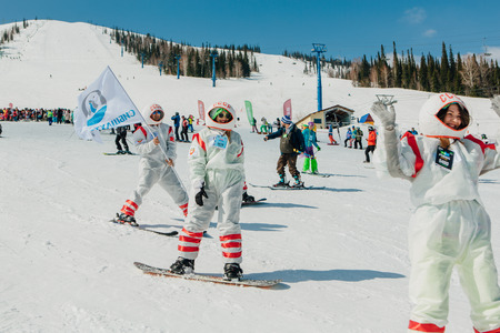 Sheregesh, Kemerovo region, Russia - April 22, 2017: Grelka Fest is a sports and entertainment activity for ski and snowboard riders in carnival costume. Young people in carnival costumes.のeditorial素材