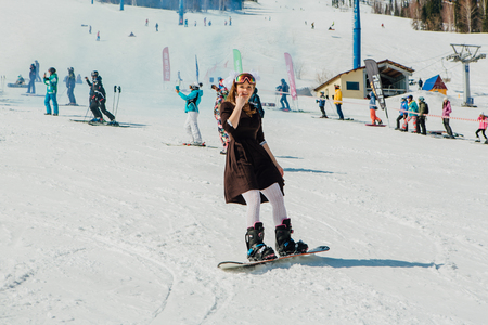 Sheregesh, Kemerovo region, Russia - April 22, 2017: Grelka Fest is a sports and entertainment activity for ski and snowboard riders in carnival costume. Young people in carnival costumes.のeditorial素材