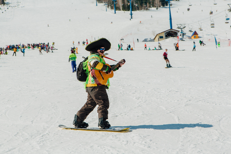 Sheregesh, Kemerovo region, Russia - April 22, 2017: Grelka Fest is a sports and entertainment activity for ski and snowboard riders in carnival costume. Young people in carnival costumes.のeditorial素材