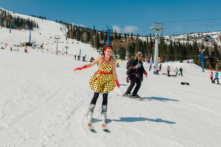 Sheregesh, Kemerovo region, Russia - April 22, 2017: Grelka Fest is a sports and entertainment activity for ski and snowboard riders in carnival costume. Young people in carnival costumes.のeditorial素材
