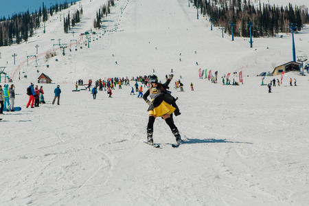 Sheregesh, Kemerovo region, Russia - April 22, 2017: Grelka Fest is a sports and entertainment activity for ski and snowboard riders in carnival costume. Young people in carnival costumes.のeditorial素材