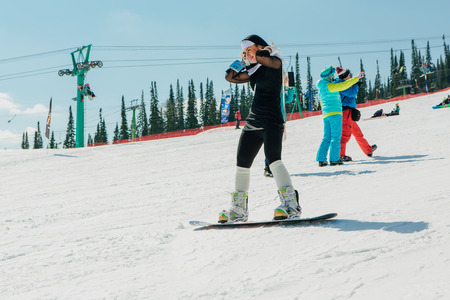 Sheregesh, Kemerovo region, Russia - April 22, 2017: Grelka Fest is a sports and entertainment activity for ski and snowboard riders in carnival costume. Young people in carnival costumes.のeditorial素材