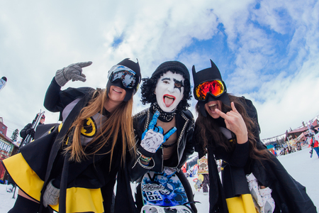 Sheregesh, Kemerovo region, Russia - April 22, 2017: Grelka Fest is a sports and entertainment activity for ski and snowboard riders in carnival costume. Two Batman girls and Paul Stanley.のeditorial素材