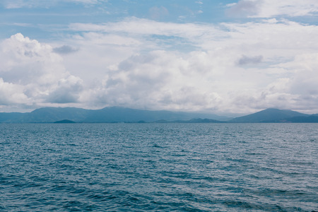 Blue sea with white clouds abstract background patternの写真素材