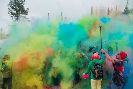 A group of a young people throwing colorful holi powder.のeditorial素材