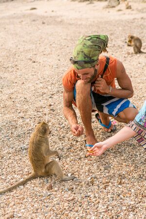 Tourists in Thailand with monkeys.のeditorial素材