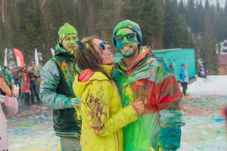 Happy young couple painted with holi colorsのeditorial素材