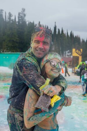 Happy young couple painted with holi colorsのeditorial素材