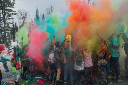 A group of a young people throwing colorful holi powder.のeditorial素材