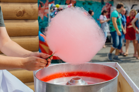 Cooking sweet pink fluffy cotton candy outdoorsの写真素材