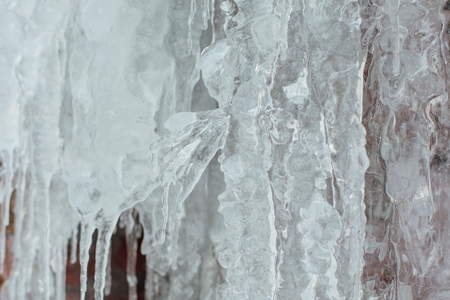 Very large and dangerous icicles close up in winterの写真素材