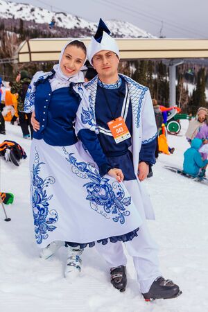 Sheregesh, Kemerovo region, Russia - April 7, 2018: Young people in carnival costumes on the mountain slope.のeditorial素材
