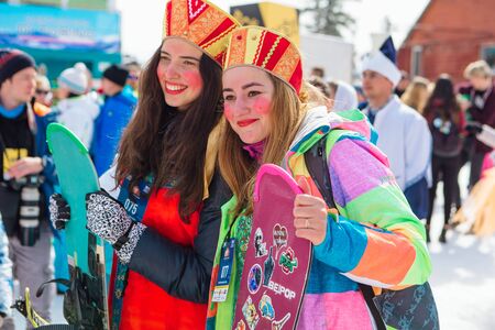 Sheregesh, Kemerovo region, Russia - April 7, 2018: Grelka Fest is a sports and entertainment activity for ski and snowboard riders in carnival costume. Young people in carnival costumes.のeditorial素材