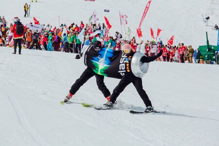Sheregesh, Kemerovo region, Russia - April 7, 2018: Grelka Fest is a sports and entertainment activity for ski and snowboard riders in carnival costume. People in a costume of a can of energetic drinkのeditorial素材