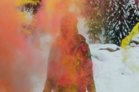 Sheregesh, Kemerovo region, Russia - April 06, 2019: Grelka Fest is a sports and entertainment activity for ski and snowboard riders in bikini. Young happy woman painted with Holi colorsのeditorial素材