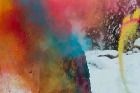 Sheregesh, Kemerovo region, Russia - April 06, 2019: Grelka Fest is a sports and entertainment activity for ski and snowboard riders in bikini. Young happy woman painted with Holi colorsのeditorial素材