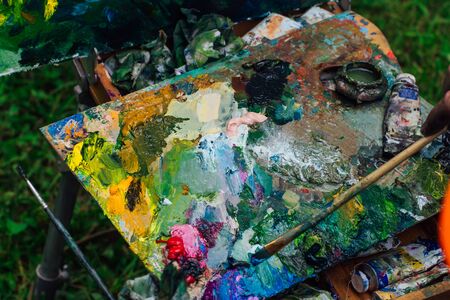 Palette with oil paints. Close up of different color oil paint.の写真素材