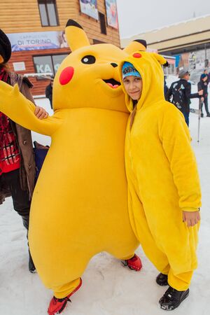 Sheregesh, Kemerovo region, Russia - April 06, 2019: Grelka Fest is a sports and entertainment activity for ski and snowboard riders in carnival costume. Young people in carnival costumes of Pikachu.のeditorial素材
