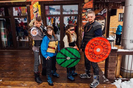 Sheregesh, Kemerovo region, Russia - April 06, 2019: Grelka Fest is a sports and entertainment activity for ski and snowboard riders in carnival costume. Young people in carnival costumes of vikings.のeditorial素材