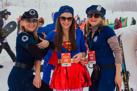 Sheregesh, Kemerovo region, Russia - April 06, 2019: Grelka Fest is a sports and entertainment activity for ski and snowboard riders in carnival costume. Young people in carnival costumes.のeditorial素材