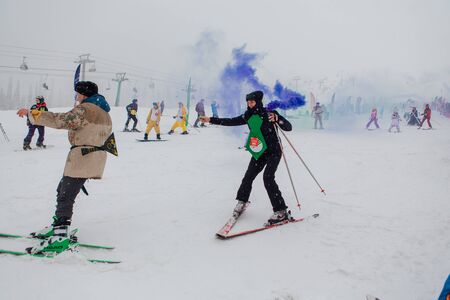 Sheregesh, Kemerovo region, Russia - April 06, 2019: Grelka Fest is a sports and entertainment activity for ski and snowboard riders in carnival costume. Young people in carnival costumes.のeditorial素材